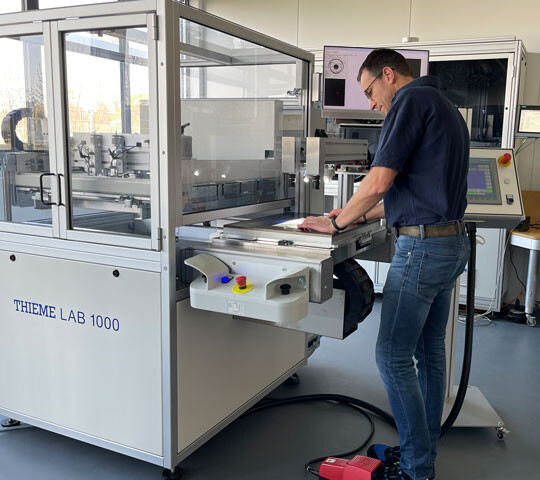 The THIEME LAB 1000 screen printing machine in action at the Technology Center